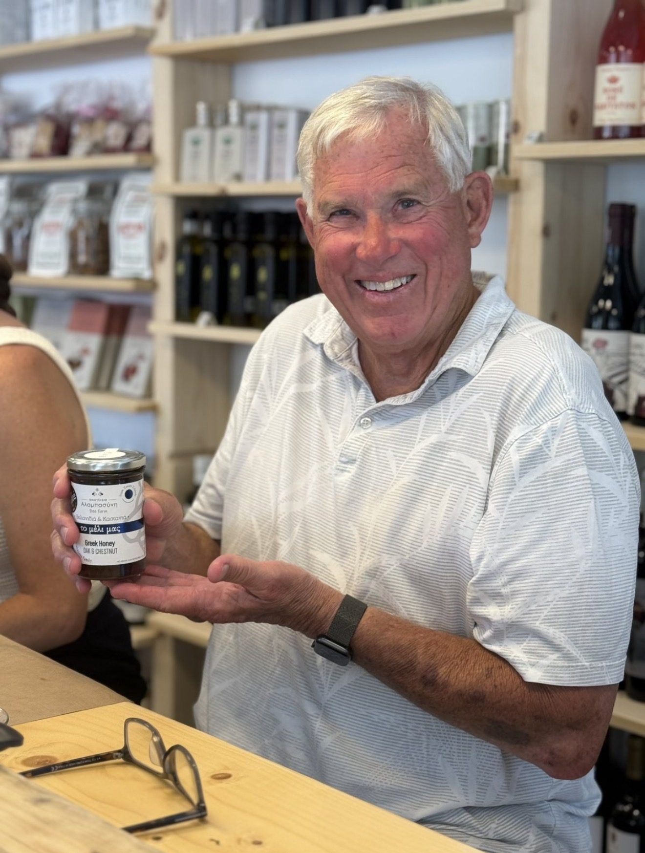 Guest holding a jar of honey